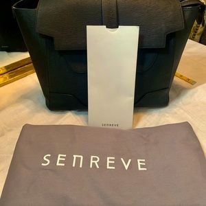 Senreve. Large. Black in color. Good condition.
